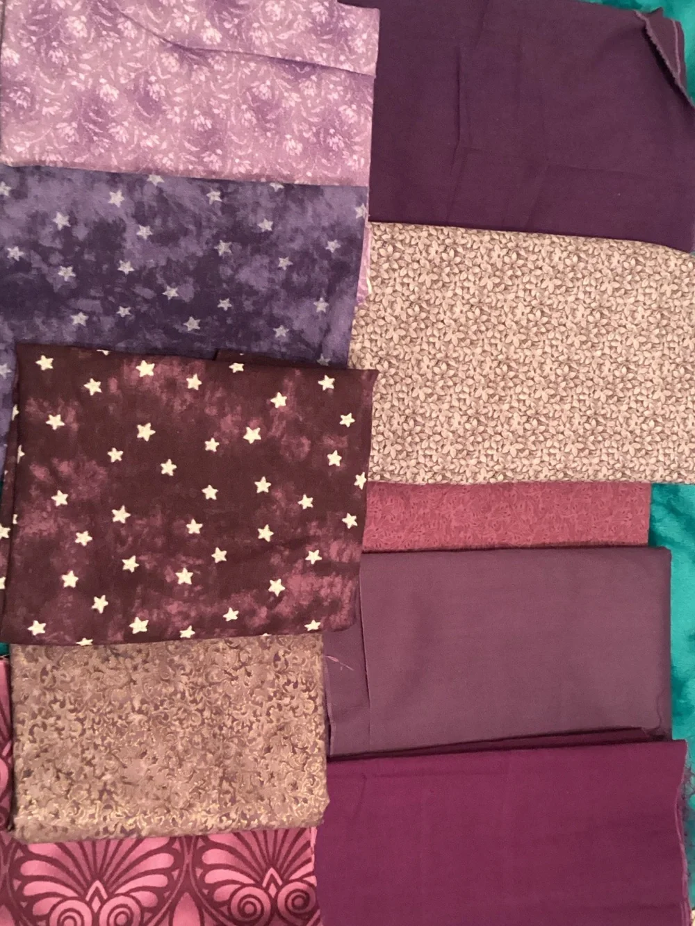 Assorted purple fabrics